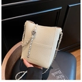 Chic beige bucket bag in lychee pattern leather with stylish metal chain strap - Off-white