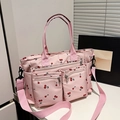 Pink nylon tote bag with cherry pattern featuring multi-pocket design and strap - Pink