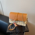 Minimalist straw crossbody bag with brown leather flap and stylish golden chain strap - Off White