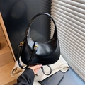 Elegant black glossy half-moon underarm bag with gold zipper and adjustable strap - Black