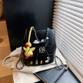 Black leather backpack with embroidered duck pattern and a yellow duckling charm accessory - With Charm Style / Black