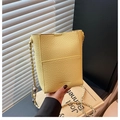 Chic light yellow bucket bag in lychee pattern leather with a chain shoulder strap - Cheese Yellow