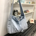Light blue drawstring shoulder bag with crinkled texture for casual commuting - Blue