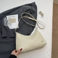 Cream lychee textured crossbody bag with adjustable strap on a minimalist background - No Pendant / Off White