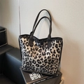 Chic leopard print tote bag in black and grey fabric with thick woven shoulder handles - Gray
