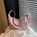 Pink glossy faux leather shoulder bag with decorative lace ribbon and silver buckle strap - Pink with Pendant