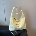 Light yellow pleated canvas tote bag with Enjoy Your Weekend print and wide shoulder strap - Yellow