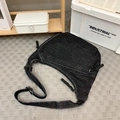 Black denim dumpling shoulder bag with contrast stitching and adjustable strap - Black