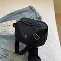 Minimalist black nylon crossbody pillow bag with multi-layer zipper pockets and wide strap - Black