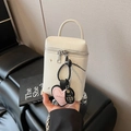 Chic cream white leather bucket bag with heart pendant and top handle design - White with Pendant