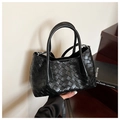 Classic black woven leather bucket bag with top handles and adjustable shoulder strap - Black