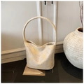 Chic cream bucket bag with yellow floral pattern and minimalist circular handle - Beige