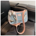 Denim shoulder bag in light blue with pink trim, silver bow and pearl chain - Blue & Pink