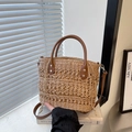 Straw woven bucket bag with brown leather handles and adjustable shoulder strap - Khaki
