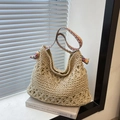 Beige straw tote bag featuring hollow floral knit and colorful ethnic shoulder strap - Off White