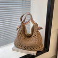 Handwoven brown straw hobo bag with colorful geometric jacquard strap in a boho style - Khaki