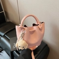 Pink lychee grain leather bucket bag with cute plush puppy charm and top handle - With Charm / Pink