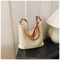 Beige crochet beach tote with slim brown leather strap in a bohemian summer style - Beige