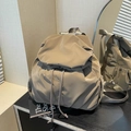 Minimalist khaki waterproof nylon backpack with drawstring closure and ruched texture finish - Brown
