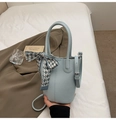 Light blue bucket bag with lychee texture, silk scarf detail and adjustable strap - Blue