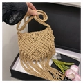 Detail of bohemian handmade macrame crossbody bag with fringe and woven texture - Khaki