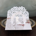 Detail of 3D laser-cut wedding invitation with white floral arch and silhouette design - White