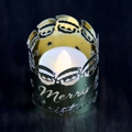 Macro view of gold metal Christmas candle holder with Merry Christmas cutout design - Mirror Gold