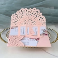 Pink laser cut wedding invitation with 3D rose pattern and silhouette on glass tray - Light Pink