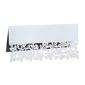 Macro detail of laser cut white leaf table card with pearlescent shimmer and floral pattern - White