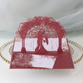 Detail of laser-cut burgundy wedding card with rose arch and couple silhouette - Dark Red