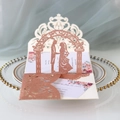 Detailed laser-cut rose gold glitter wedding invitation with romantic couple arch design - Glitter Champagne Gold