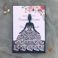 Macro detail of laser-cut navy floral invitation with elegant watercolor inner card - Phantom Blue