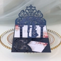 Detail of laser-cut navy blue wedding invitation with floral insert on a decorative plate - Phantom Blue