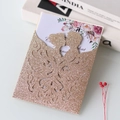 Detail of rose gold glitter laser-cut wedding card with bride and groom silhouette - Rose Gold