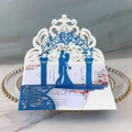 Detail of laser-cut wedding invitation featuring blue glitter silhouette on white lace base - Glitter Royal Blue