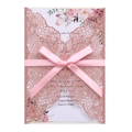 Detail of laser cut glitter wedding invitation with pink ribbon bow and floral inner card - Glitter Pink