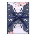 Navy blue laser cut wedding invitation detail with satin ribbon bow and floral card - Magic Blue