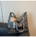 Detail of grey floral jacquard tote bag with a brown plush bear charm and wide strap - Black with Pendant
