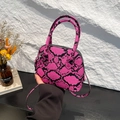 Pink snakeskin patterned shell bag for women with round handle and silver crossbody strap - Snake Pattern Rose Red