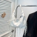 White hobo shoulder bag with long fringes and bow detail on a sleek metal hanger - White
