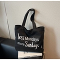 Black canvas tote bag with white 'less Mondays more Sundays' embroidery on book - Black