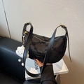 Black crescent dumpling bag in textured fabric with a white plush cloud charm accessory - Black