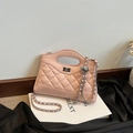 Elegant light pink quilted handbag with silver chain strap and metal turn-lock closure - Pink