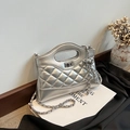 Silver metallic quilted chain bag with circular handle and elegant leather strap - Silver
