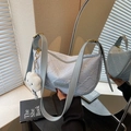 Light blue pleated shoulder bag with floral embroidery and cloud-shaped plush charm - Blue