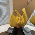 Bright yellow lychee grain leather hobo bag with elegant silver buckle and adjustable strap - Yellow