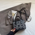 Small black leather bucket bag with white geometric patterns and adjustable shoulder strap - Black without Pendant