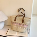 Handwoven straw tote bag with pink geometric accents and dark brown leather straps - Pink