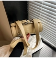 Detailed macro of khaki Boston bag with decorative buckle and large bow tie - Khaki