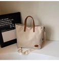 Minimalist beige canvas tote bag with brown leather handles and adjustable shoulder strap - Beige No Pendant